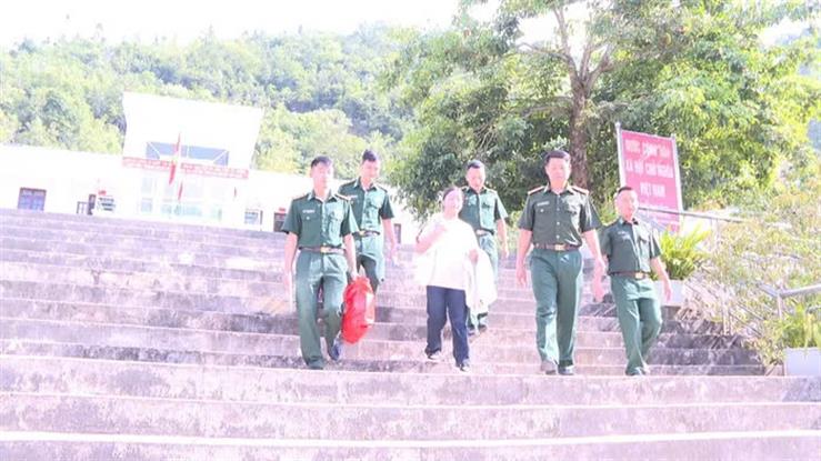 A group of people in uniform walking up stairsDescription automatically generated